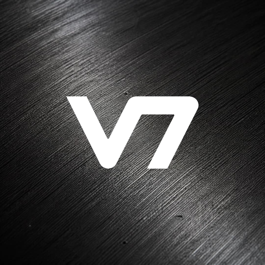 White V7 logo over a black graphite macro texture.