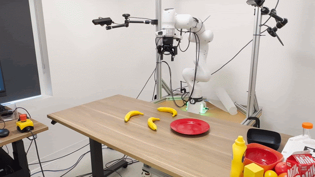 Robot arm picking up a banana
