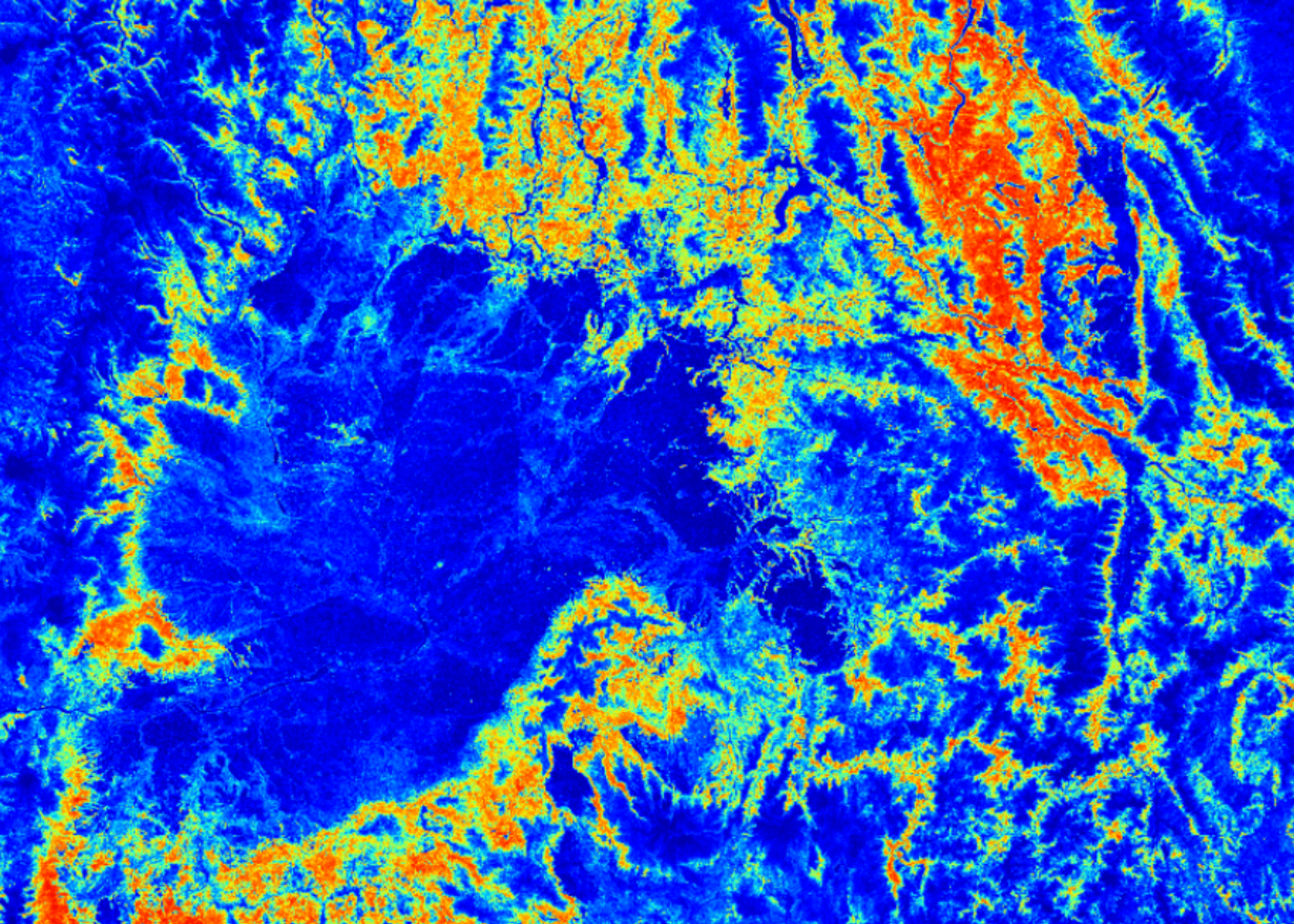 Close-up of a wildfire-risk heatmap over terrain, from blue (lower risk) to red (higher risk)