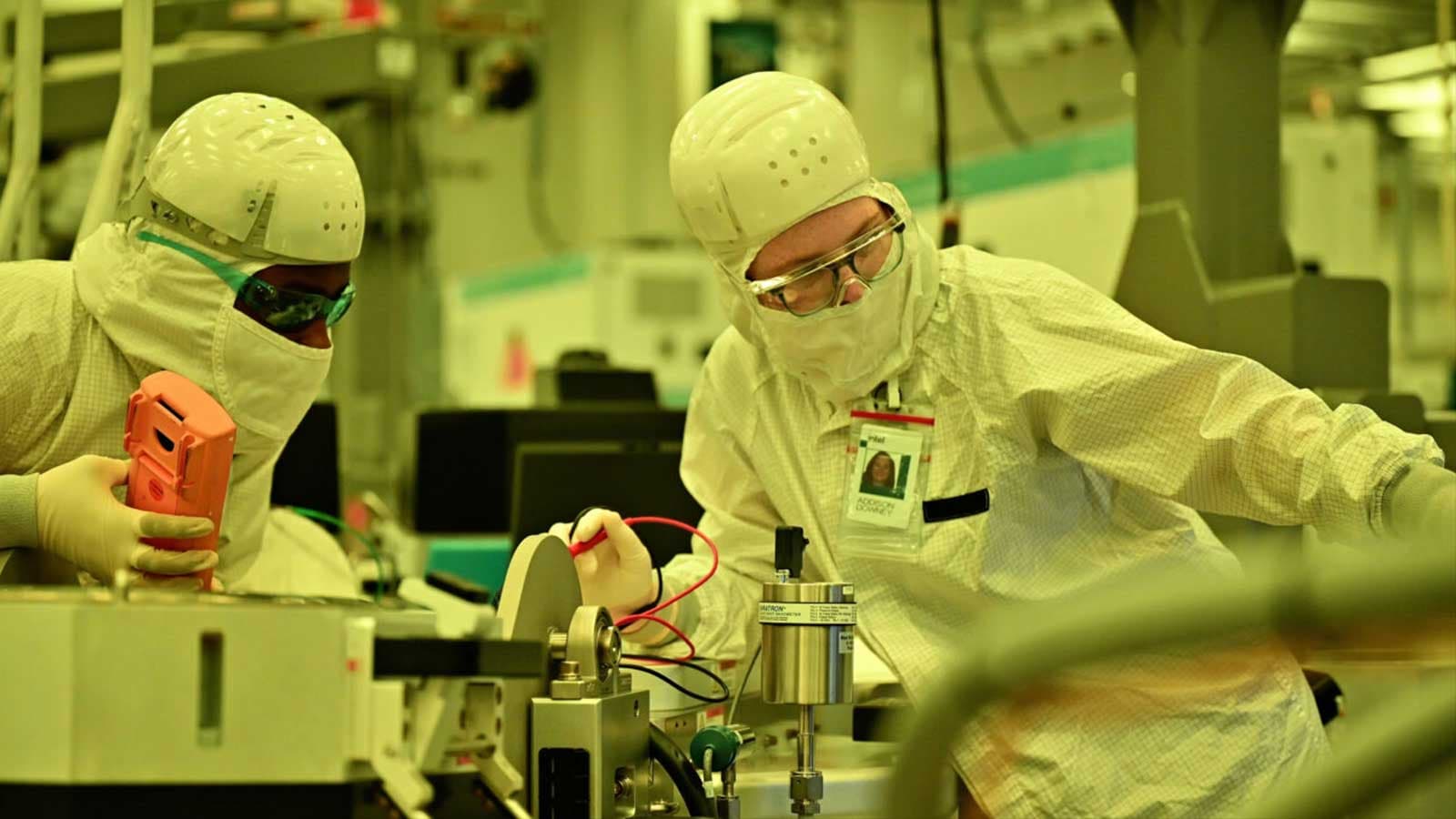 Intel engineers working in a clean room environment.