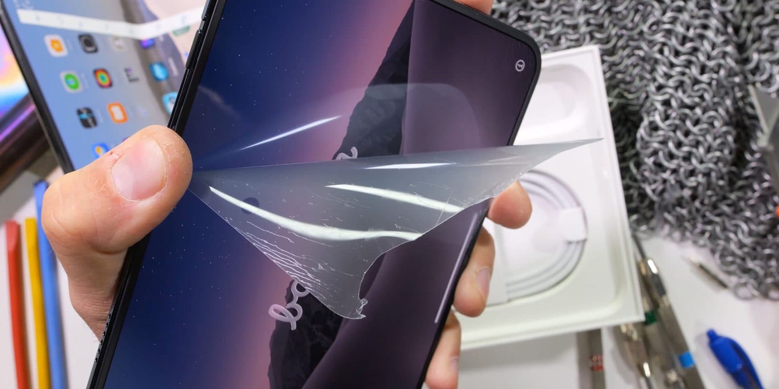 iPhone Duo tested to destruction, including removing nanotexture layer | Photo shows the layer being peeled off